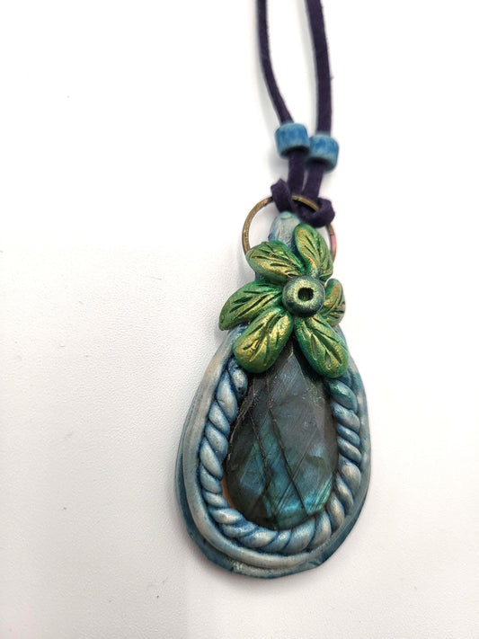 Blue Labradorite Stone pendant, sculptured bezel on a leather cord.