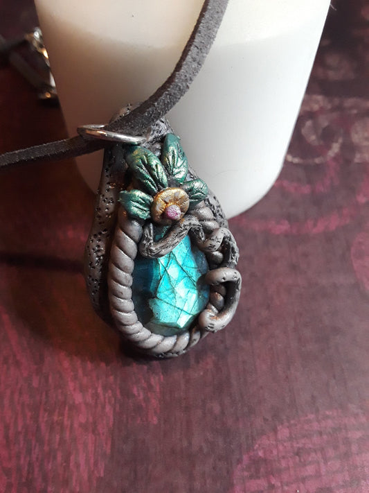 Blue Labradorite Stone pendant, sculptured bezel on a leather cord.