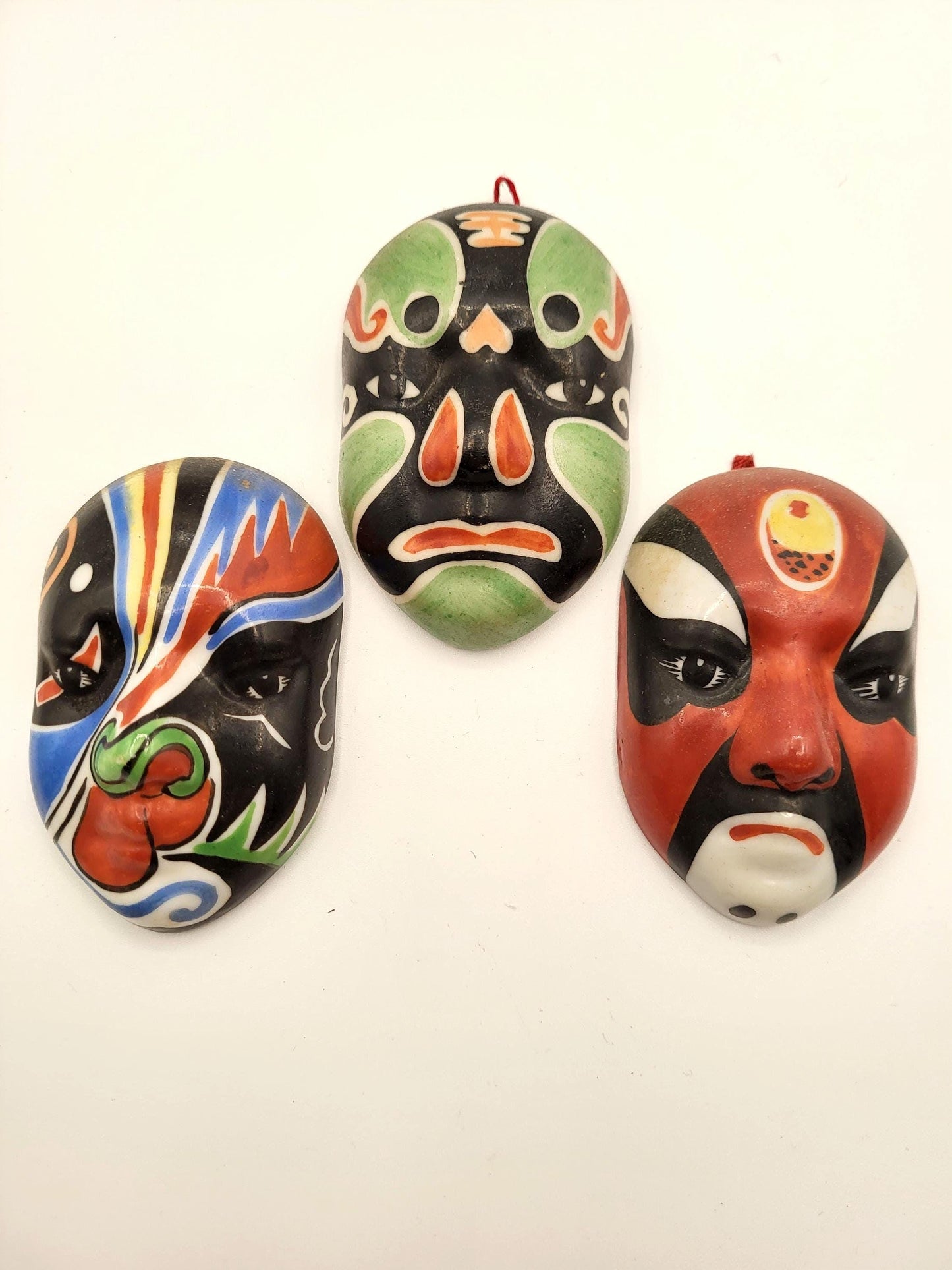 Small ceramic vintage masks. Could be Chinese or Japanese.