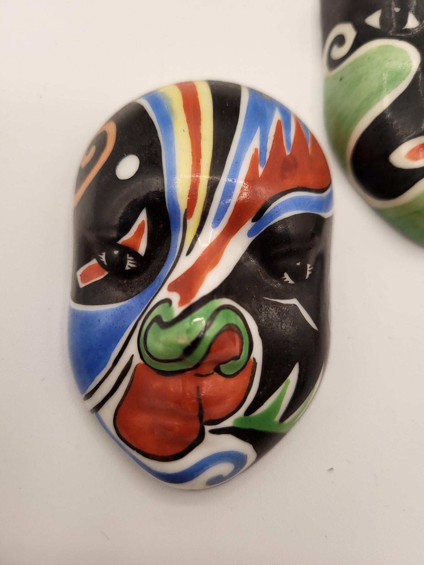 Small ceramic vintage masks. Could be Chinese or Japanese.