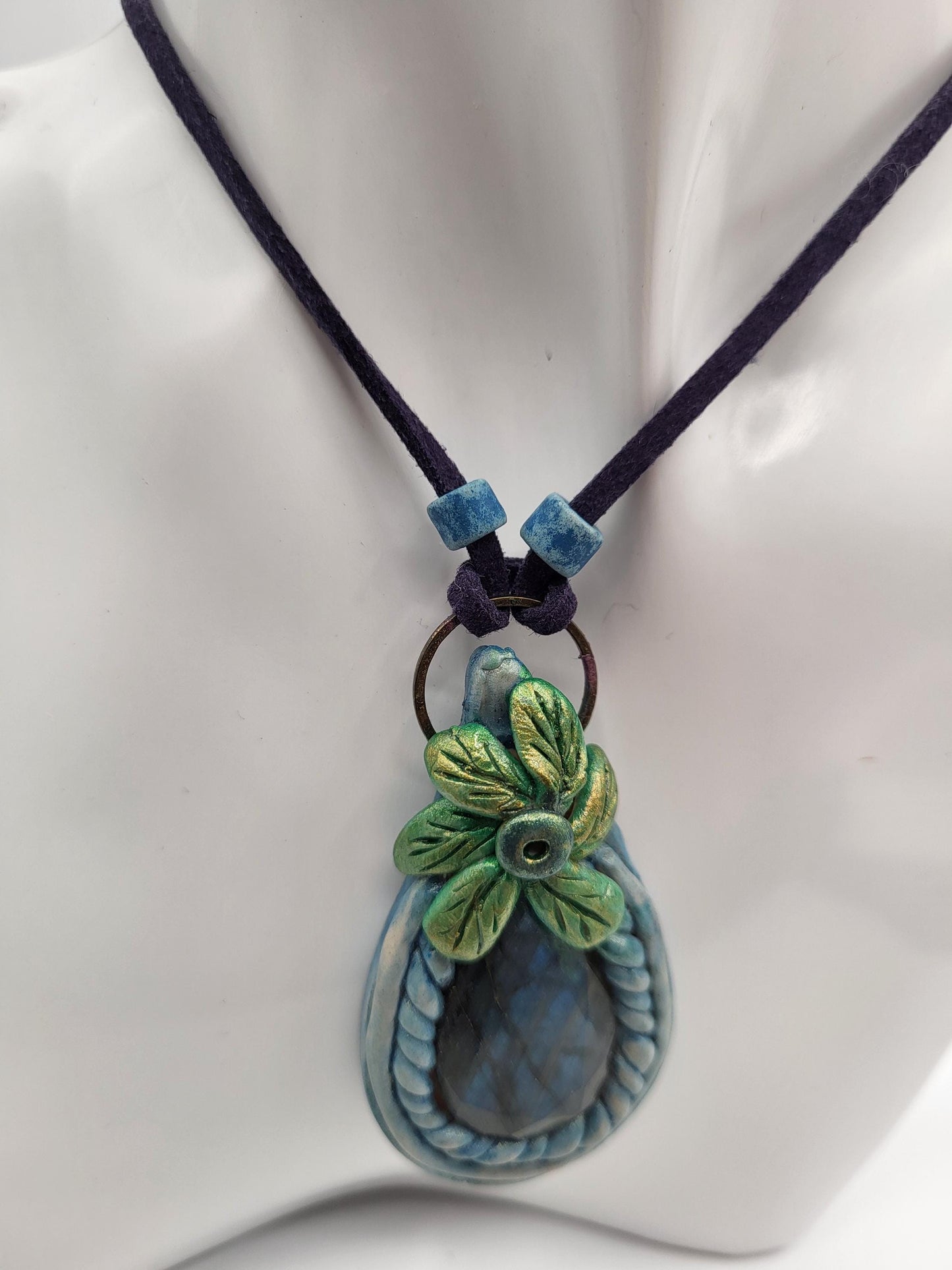 Blue Labradorite Stone pendant, sculptured bezel on a leather cord.