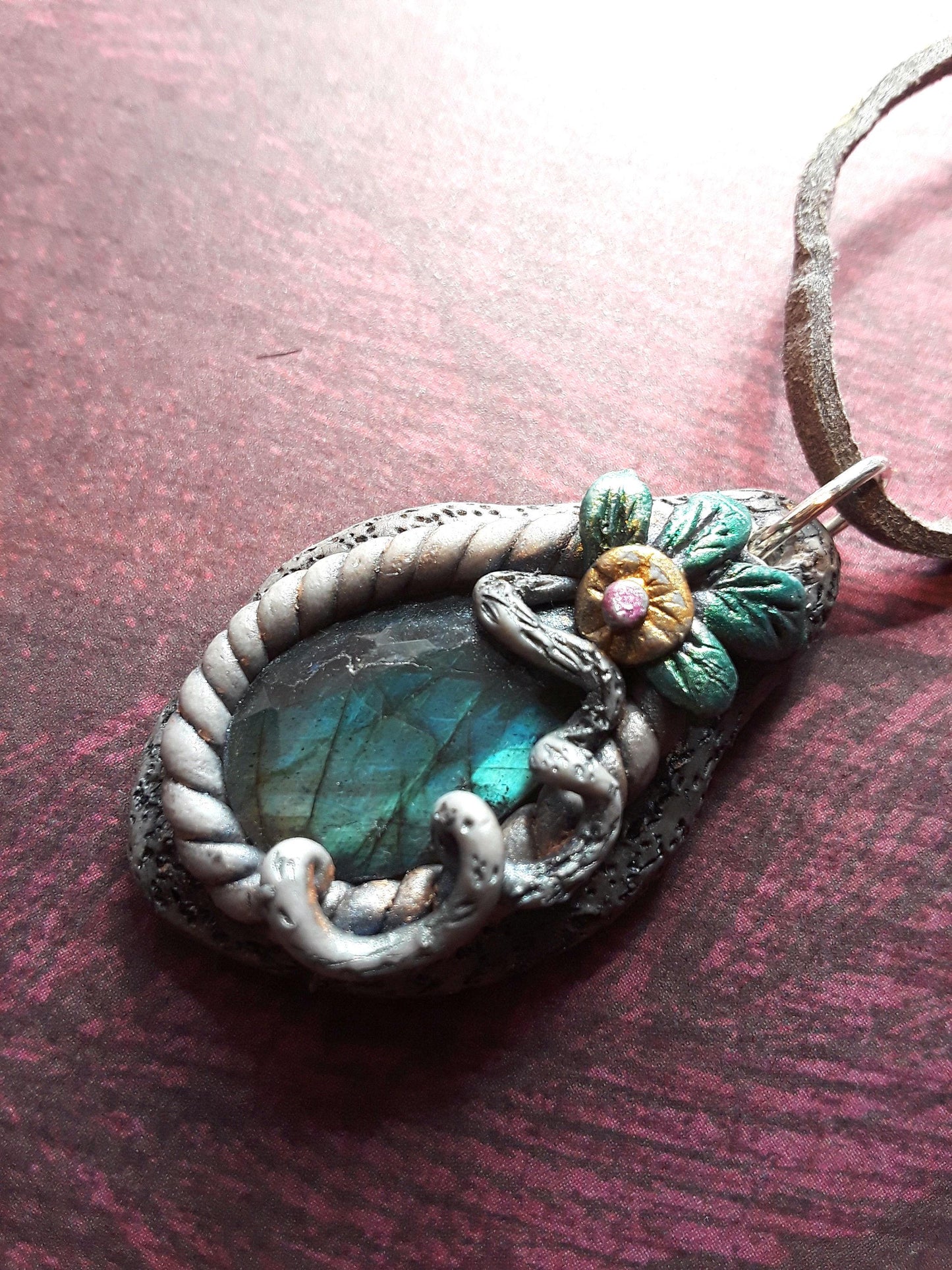 Blue Labradorite Stone pendant, sculptured bezel on a leather cord.