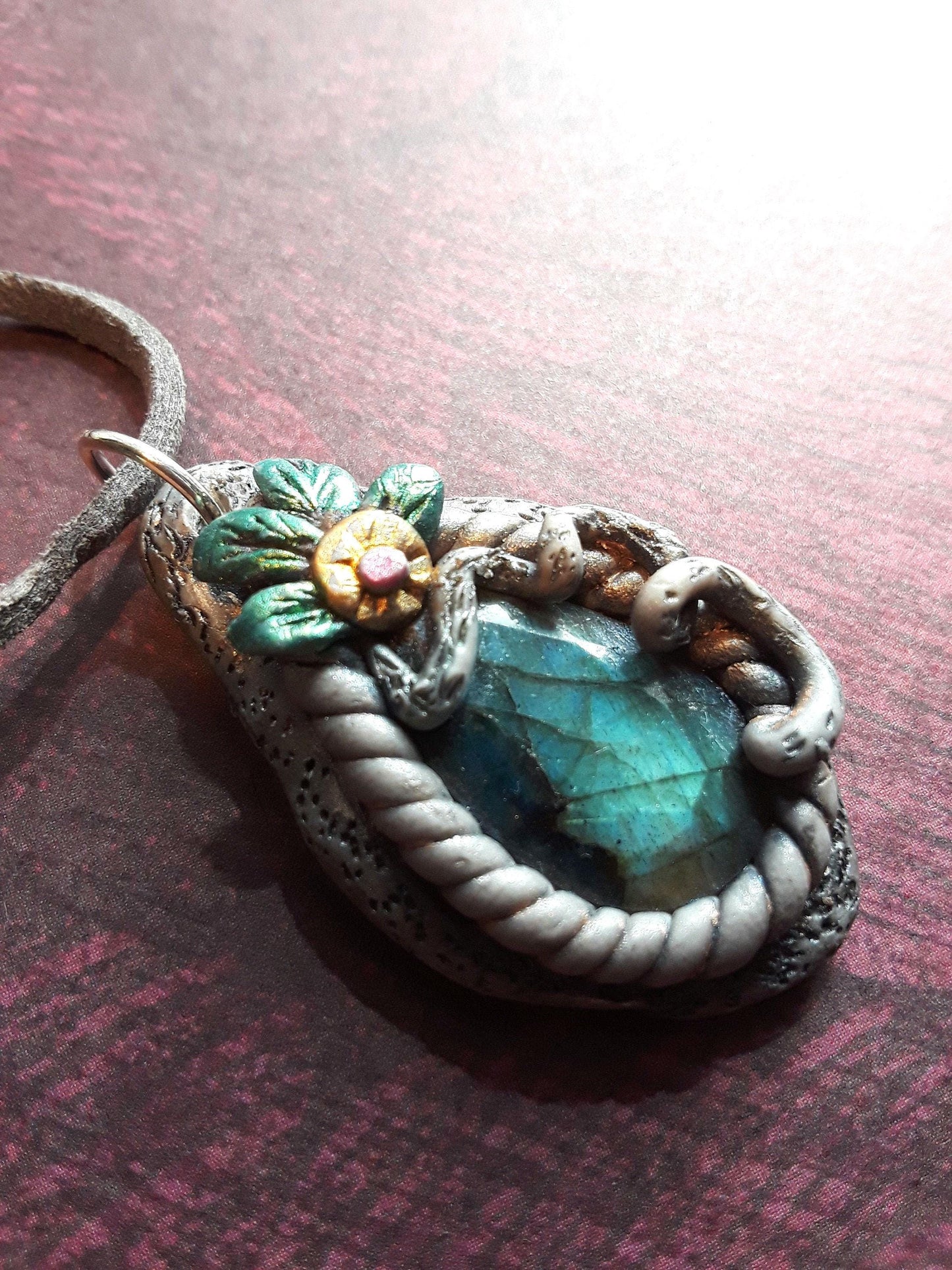 Blue Labradorite Stone pendant, sculptured bezel on a leather cord.